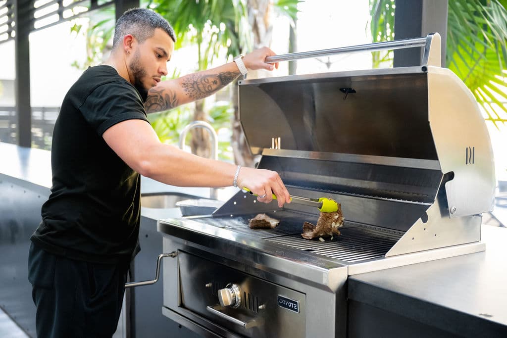 Grilling at the outdoor kitchen at Metro Parc