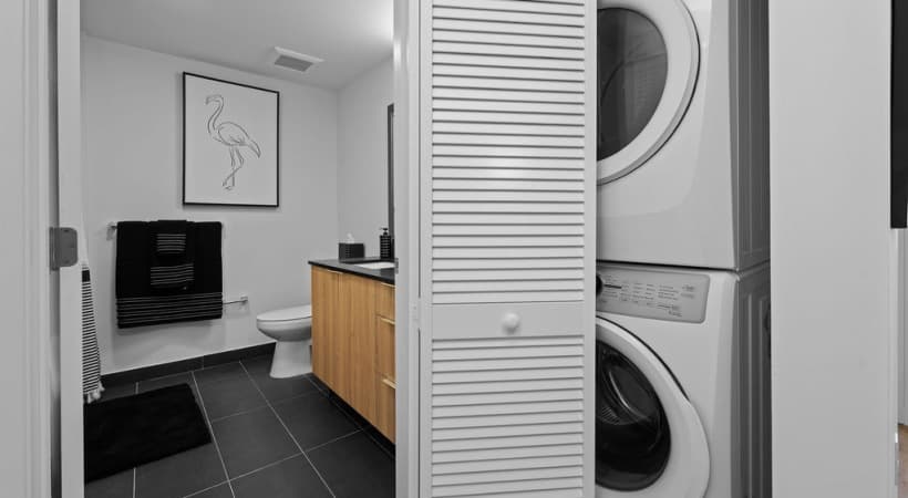 Bathroom with in-unit laundry at Metro Parc