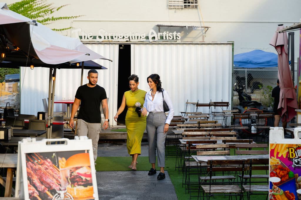 Friends exploring the local food park near Hialeah apartments